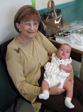 My mother holding her granddaughter shortly after conventional heart surgery!